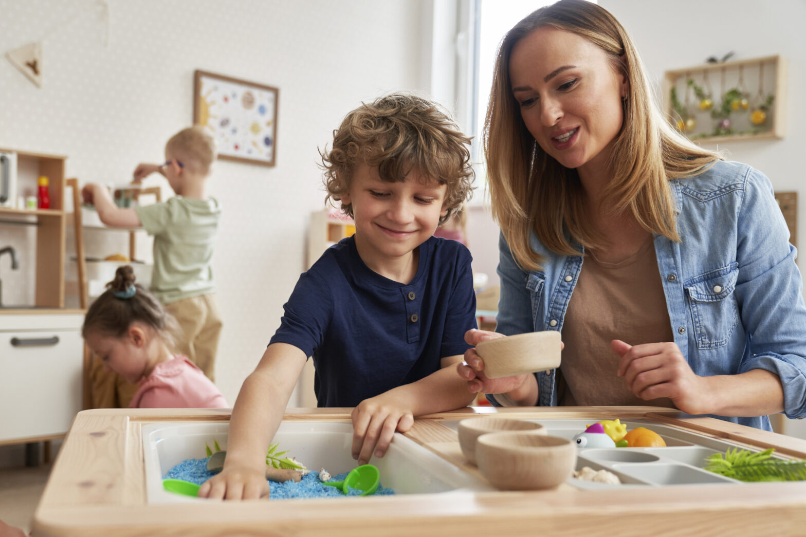 Physiotherapist doing sensory exercises with children